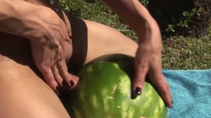 Shemale fucks a watermelon