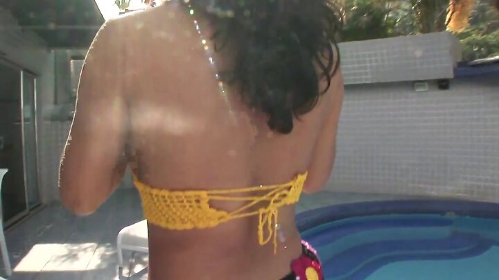 Curvy shemale gets her pretty face jizzed on by the pool