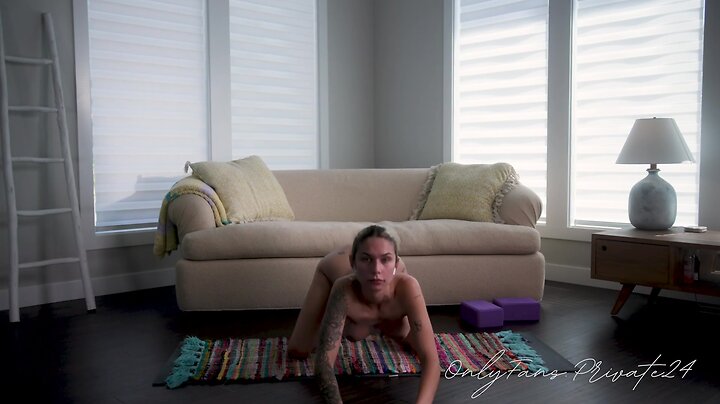 Fine trans model does yoga nude in studio