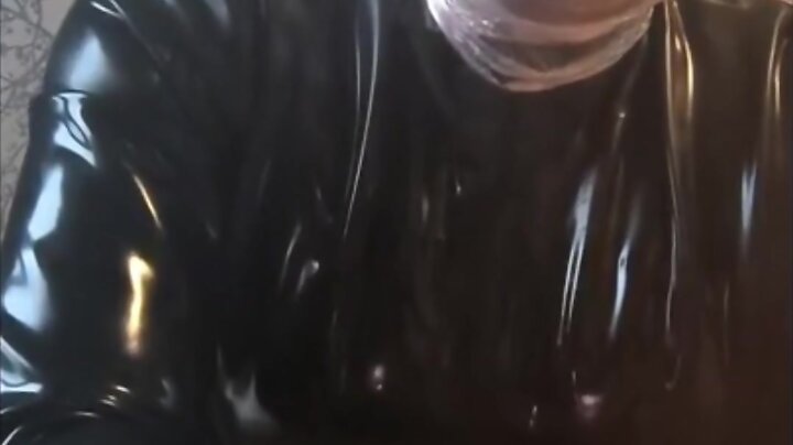 Breath play in latex catsuit with cling film
