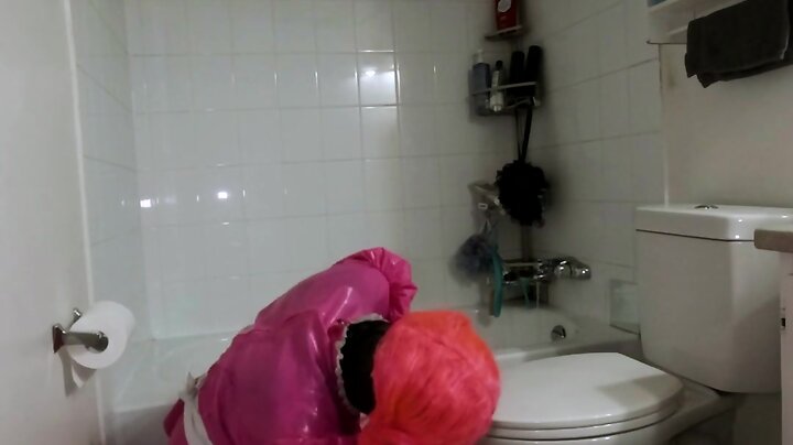 Steel chastity belt and dildo cleaning bathroom by a sissy maid
