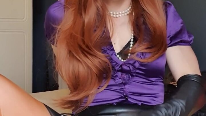Ginger secretary in a purple satin blouse