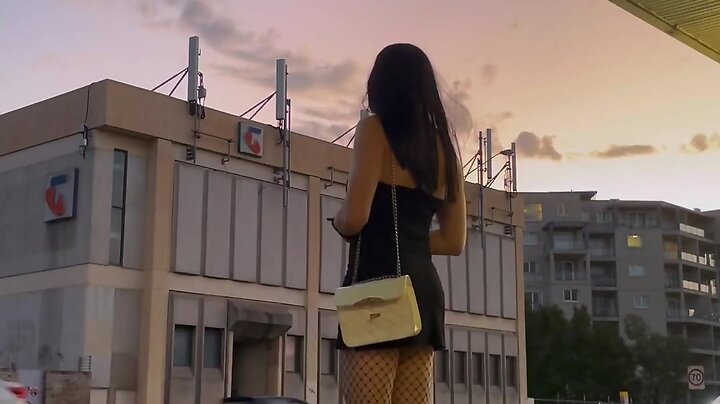 Strolling in public: fishnet stockings and black dress outfit